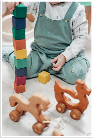 Child care preschooler stacking blocks